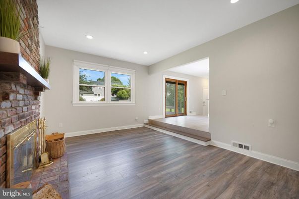Empty room, Fireplace, Interior, Recessed Lighting, Stone Walls, Wood Texture Flooring