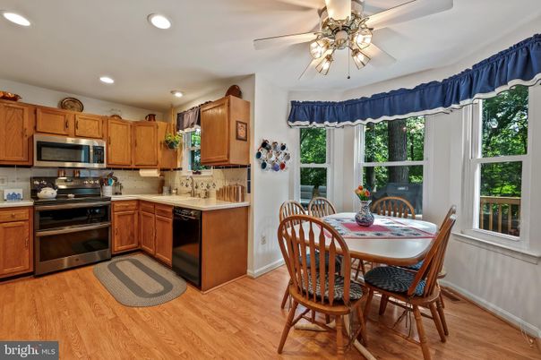 Dining room, Interior, Kitchen, Recessed Lighting, Stainless Steel Appliances, Wood Texture Flooring
