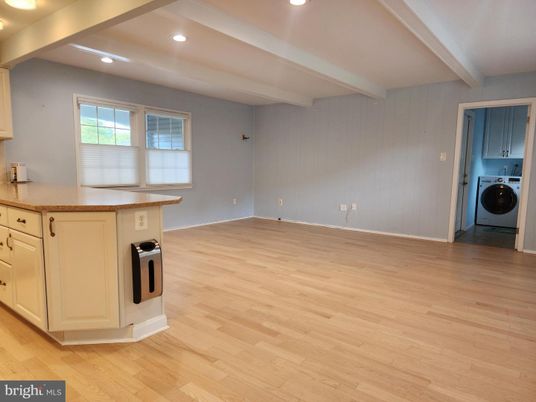 Empty room, Interior, Kitchen, Recessed Lighting, Washer, Wood Texture Flooring