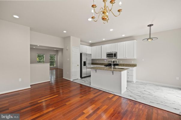 Chandelier, Interior, Kitchen, Marble, Pendant Lights, Recessed Lighting, Stainless Steel Appliances, Wood Texture Flooring