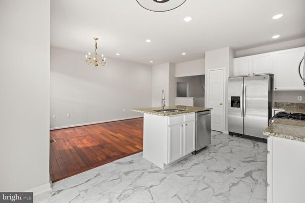 Chandelier, Interior, Kitchen, Marble, Pendant Lights, Recessed Lighting, Stainless Steel Appliances, Wood Texture Flooring