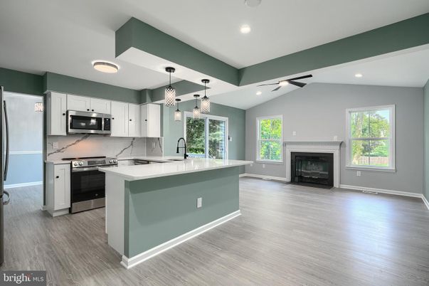 Fireplace, Interior, Kitchen, Pendant Lights, Recessed Lighting, Stainless Steel Appliances, Wood Texture Flooring