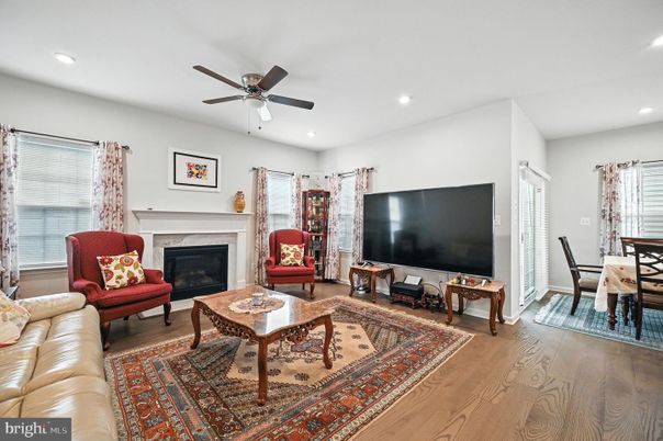 Dining room, Fireplace, Interior, Living room, Recessed Lighting, Wood Texture Flooring