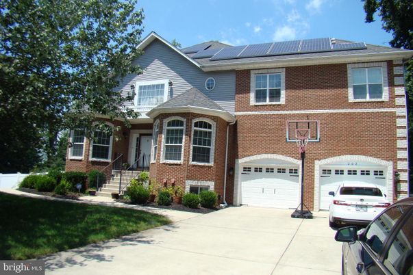 Attached, Exterior, Facade, Brick Facade, Solar Panels, Brick Traditional