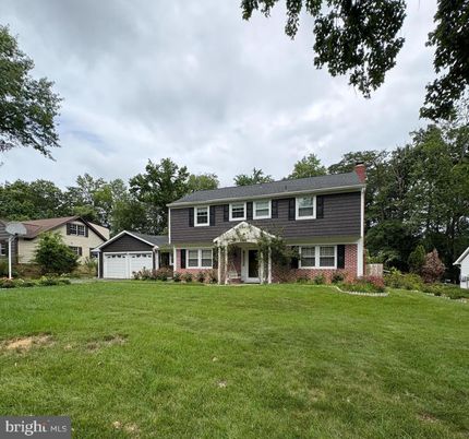 Attached, Backyard, Detached Garage, Exterior, Facade, Brick Facade, Raised Ranch