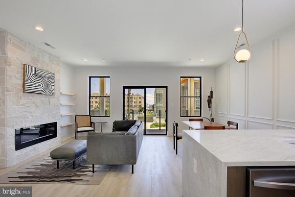 Fireplace, Interior, Living room, Pendant Lights, Recessed Lighting, Stone Walls, Wood Texture Flooring
