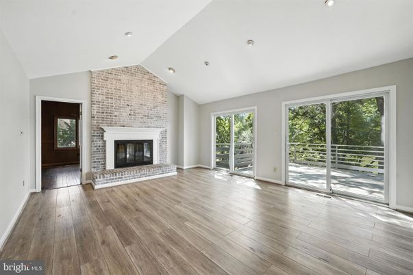 Empty room, Fireplace, Interior, Recessed Lighting, Stone Walls, Wood Texture Flooring