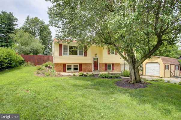 Attached, Backyard, Detached Garage, Exterior, Facade, Brick Facade, Raised Ranch