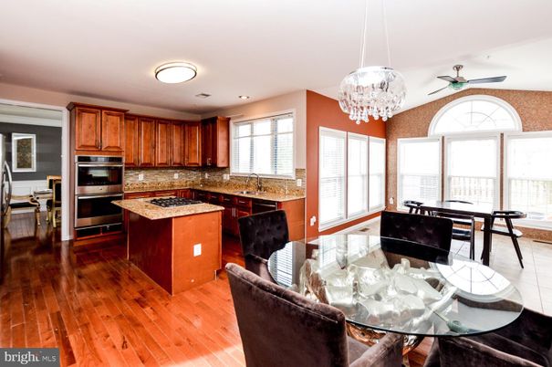 Chandelier, Dining room, Interior, Kitchen, Recessed Lighting, Stainless Steel Appliances, Wood Texture Flooring
