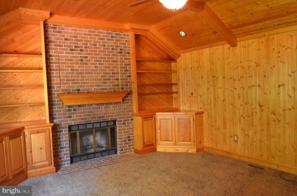 Empty room, Fireplace, Interior, Recessed Lighting, Stone Walls, Wooden Beams, Wooden Ceilings, Wooden Walls