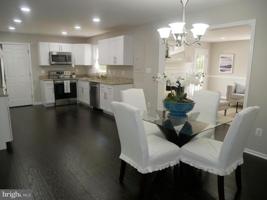 Chandelier, Dining room, Interior, Kitchen, Recessed Lighting, Stainless Steel Appliances, Wood Texture Flooring