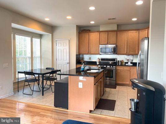 Dining room, Interior, Kitchen, Recessed Lighting, Stainless Steel Appliances, Wood Texture Flooring