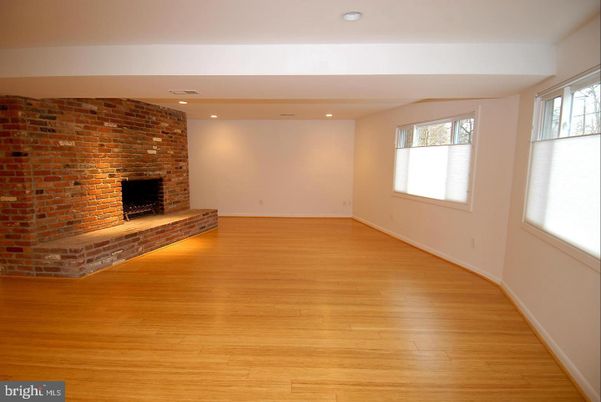 Empty room, Fireplace, Interior, Recessed Lighting, Stone Walls, Wood Texture Flooring