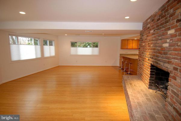Empty room, Fireplace, Interior, Recessed Lighting, Stone Walls, Wood Texture Flooring