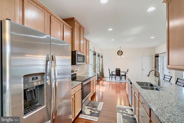 Dining room, Interior, Kitchen, Pendant Lights, Recessed Lighting, Stainless Steel Appliances, Wood Texture Flooring
