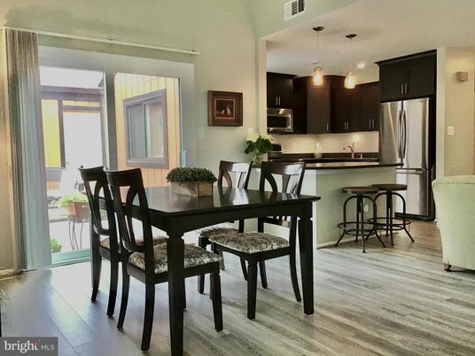 Dining room, Interior, Kitchen, Pendant Lights, Stainless Steel Appliances, Wood Texture Flooring