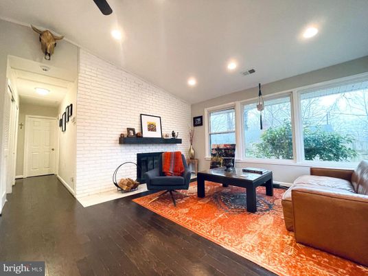 Fireplace, Game Room, Interior, Living room, Pendant Lights, Recessed Lighting, Stone Walls, Wood Texture Flooring
