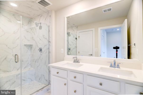 Bathroom, Dual Sink Vanities, Glass Shower, Interior, Marble Walls, Recessed Lighting