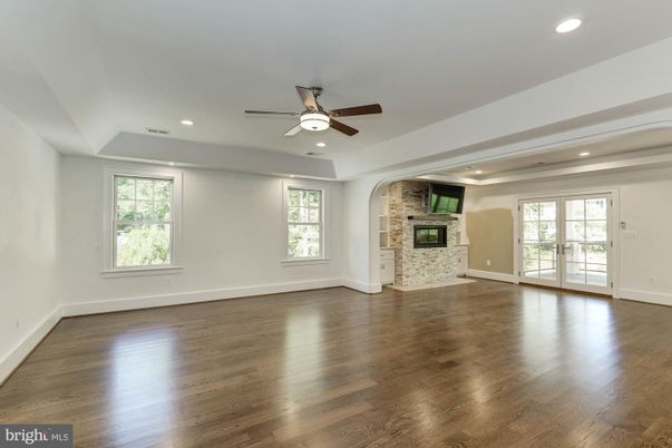 Empty room, Fireplace, Interior, Recessed Lighting, Stone Walls, Wood Texture Flooring