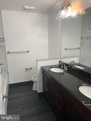 Bathroom, Dual Sink Vanities, Interior, Marble Walls, Wood Texture Flooring