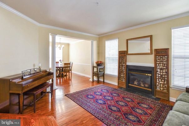 Chandelier, Dining room, Fireplace, Interior, Piano, Wood Texture Flooring