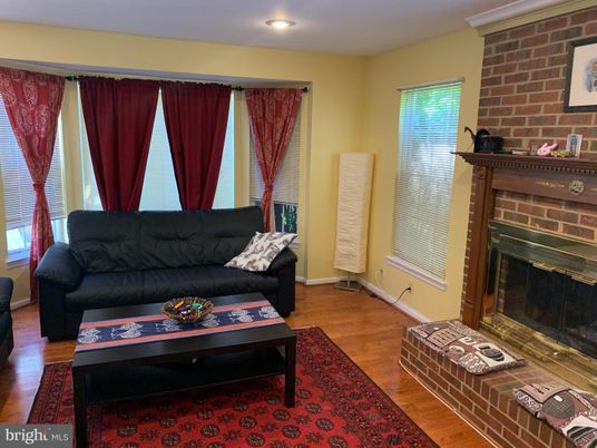 Fireplace, Interior, Living room, Recessed Lighting, Stone Walls, Wood Texture Flooring