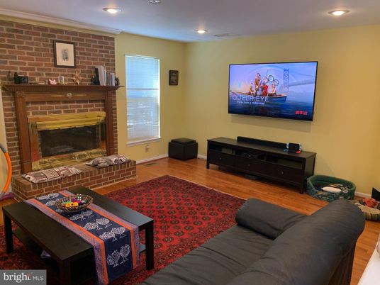 Fireplace, Interior, Living room, Recessed Lighting, Stone Walls, Wood Texture Flooring