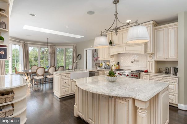 Chandelier, Dining room, Interior, Kitchen, Pendant Lights, Recessed Lighting, Stainless Steel Appliances, Wood Texture Flooring