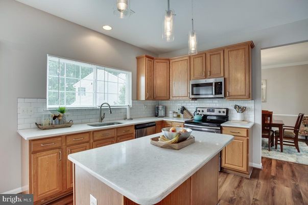 Dining room, Interior, Kitchen, Pendant Lights, Recessed Lighting, Stainless Steel Appliances, Wood Texture Flooring
