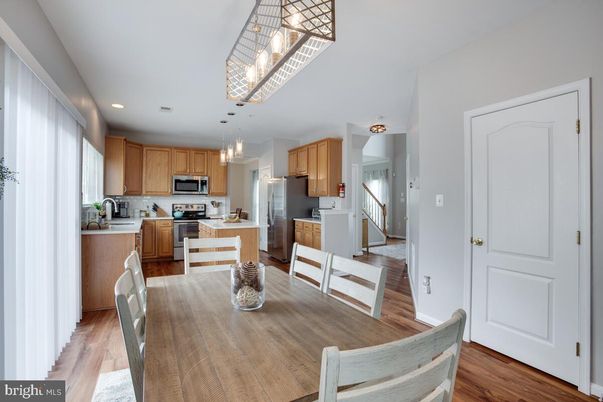 Dining room, Interior, Kitchen, Pendant Lights, Recessed Lighting, Stainless Steel Appliances, Wood Texture Flooring