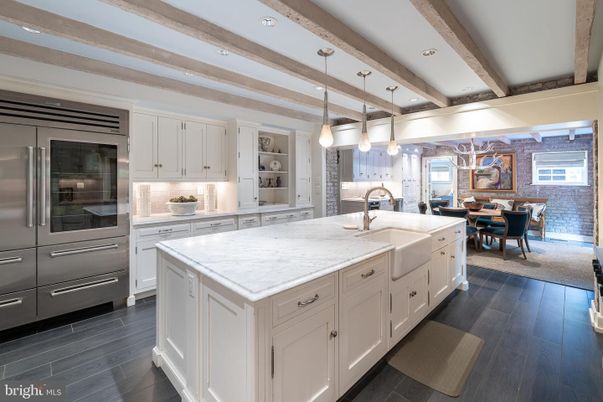 Dining room, Interior, Kitchen, Pendant Lights, Recessed Lighting, Stainless Steel Appliances, Stone Walls, Wooden Beams, Wood Texture Flooring