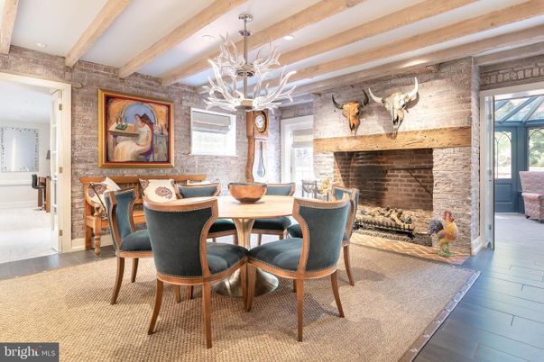 Chandelier, Dining room, Fireplace, Interior, Recessed Lighting, Stone Walls, Wooden Beams, Wood Texture Flooring