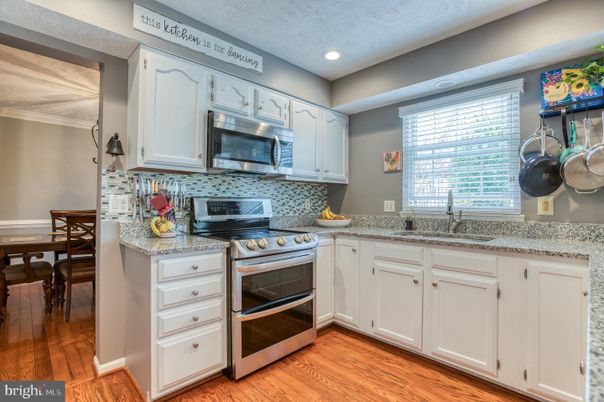 Dining room, Interior, Kitchen, Recessed Lighting, Stainless Steel Appliances, Wood Texture Flooring