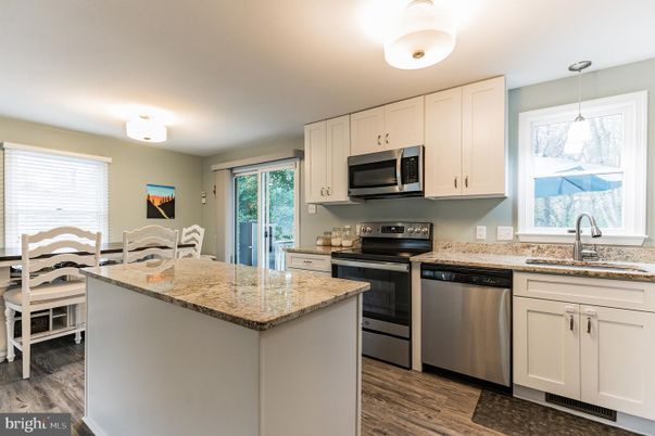 Dining room, Interior, Kitchen, Pendant Lights, Stainless Steel Appliances, Wood Texture Flooring