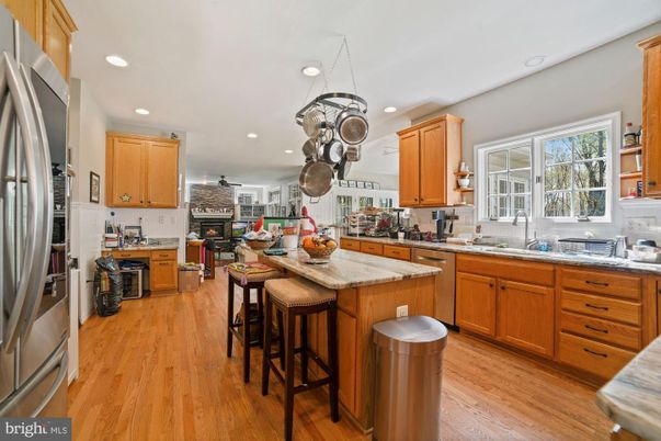 Fireplace, Interior, Kitchen, Recessed Lighting, Stainless Steel Appliances, Wood Texture Flooring