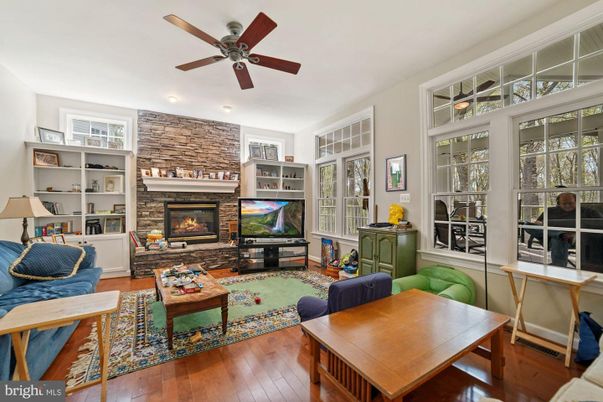 Fireplace, Interior, Living room, Recessed Lighting, Stone Walls, Wood Texture Flooring