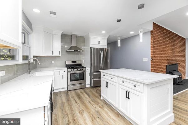 Interior, Kitchen, Pendant Lights, Recessed Lighting, Stainless Steel Appliances, Stone Walls, Wood Texture Flooring