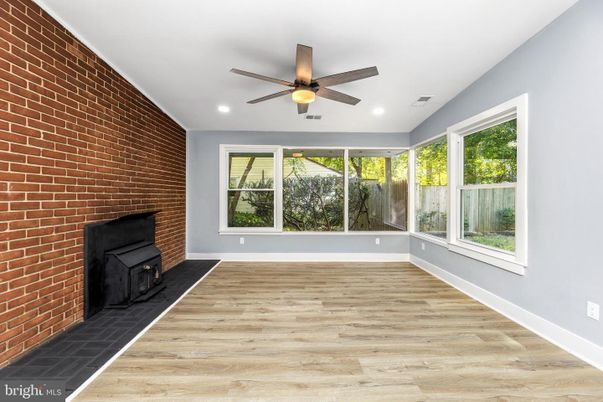 Empty room, Fireplace, Interior, Recessed Lighting, Stone Walls, Wood Texture Flooring