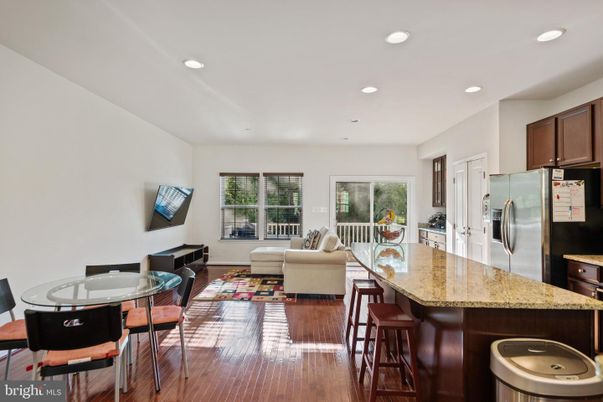 Dining room, Interior, Kitchen, Living room, Recessed Lighting, Stainless Steel Appliances, Wood Texture Flooring