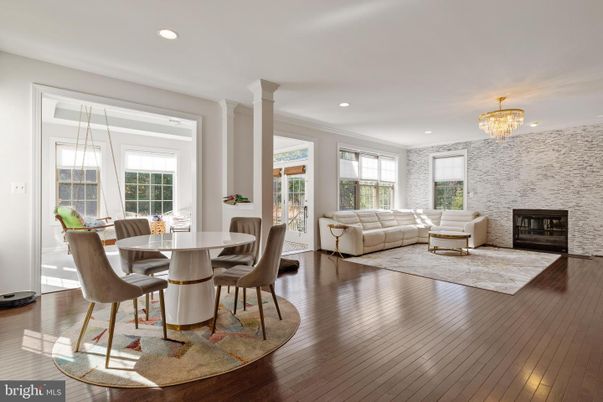 Chandelier, Dining room, Fireplace, Interior, Living room, Recessed Lighting, Wood Texture Flooring
