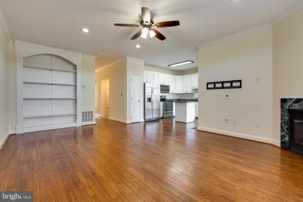 Empty room, Fireplace, Interior, Kitchen, Recessed Lighting, Wood Texture Flooring