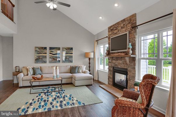 Fireplace, Interior, Living room, Recessed Lighting, Stone Walls, Wood Texture Flooring