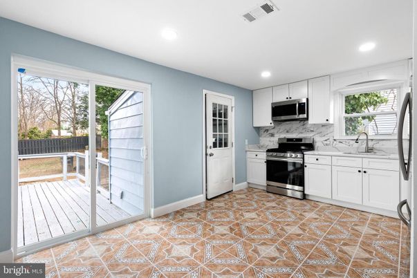 Interior, Kitchen, Marble Walls, Recessed Lighting, Stainless Steel Appliances