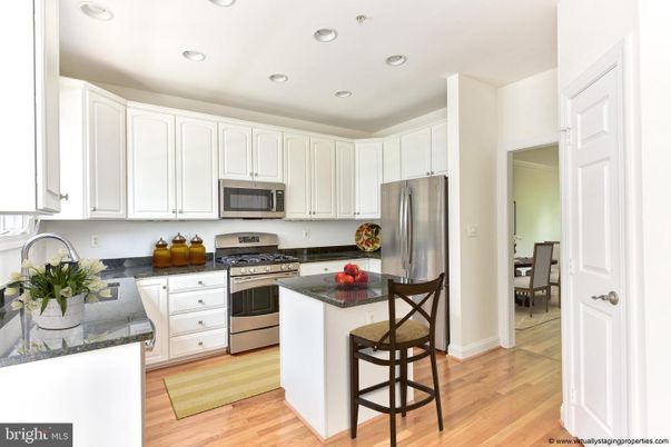 Dining room, Interior, Kitchen, Recessed Lighting, Stainless Steel Appliances, Wood Texture Flooring