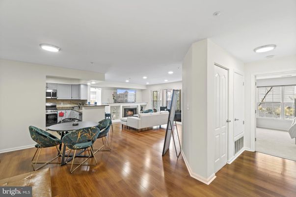 Dining room, Fireplace, Interior, Kitchen, Living room, Recessed Lighting, Stainless Steel Appliances, Wood Texture Flooring