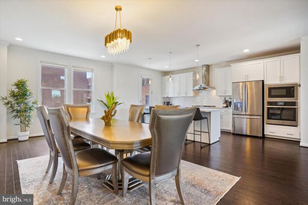 Chandelier, Dining room, Interior, Kitchen, Pendant Lights, Recessed Lighting, Stainless Steel Appliances, Wood Texture Flooring