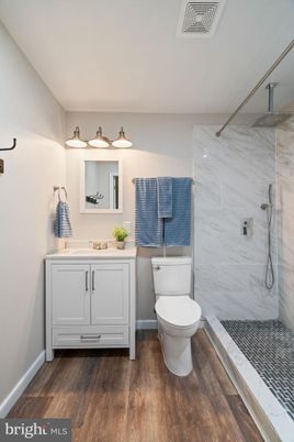 Bathroom, Glass Shower, Interior, Marble Walls, Wood Texture Flooring