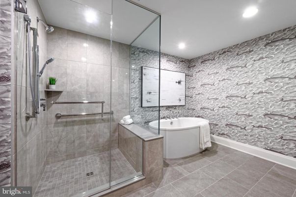 Bathroom, Free Standing Baths, Glass Shower, Interior, Recessed Lighting, Stone Walls