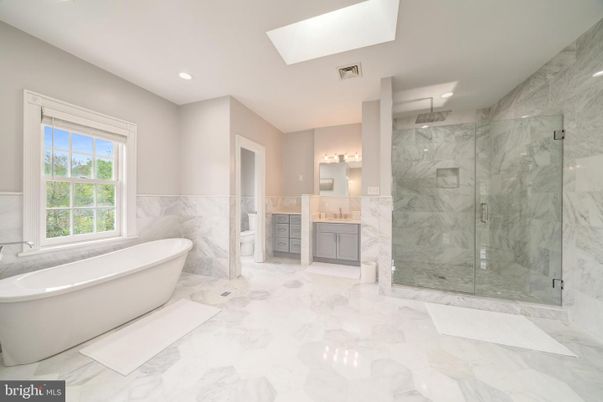 Bathroom, Dual Sink Vanities, Free Standing Baths, Glass Shower, Interior, Marble, Marble Walls, Recessed Lighting