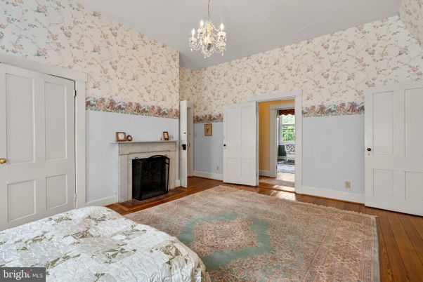 Bedroom, Chandelier, Fireplace, Interior, Wood Texture Flooring